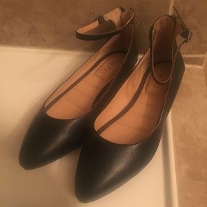 Classic black flats with ankle strap detail